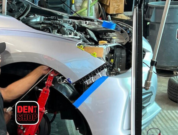 fixing car at dent shop
