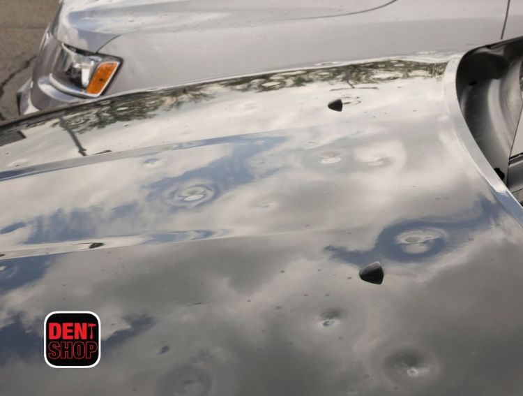 hail damage on hoods of cars