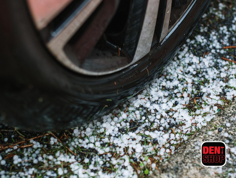 hail on ground next to car tire